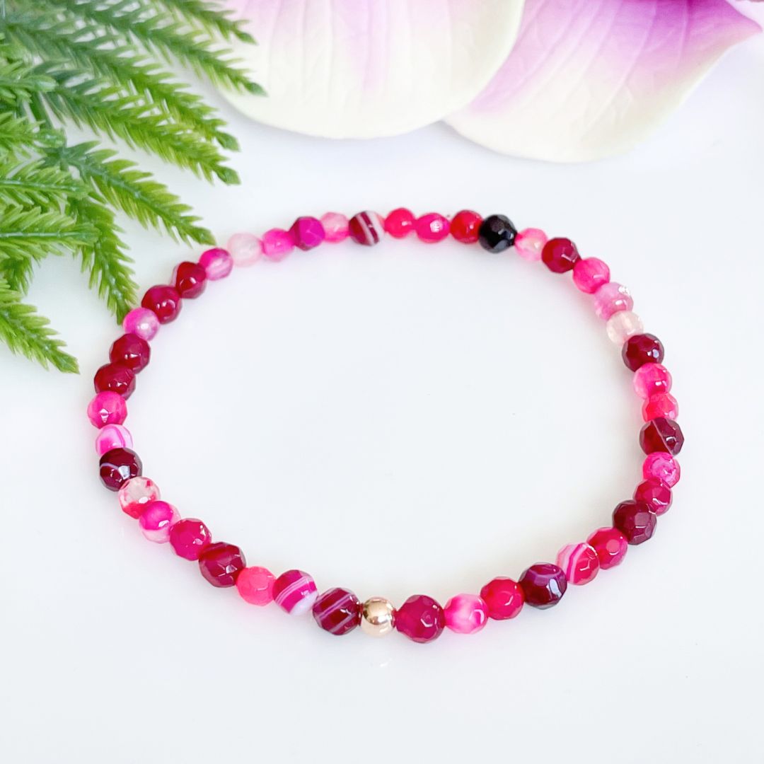 4mm faceted pink agate bracelet with gold accent bead