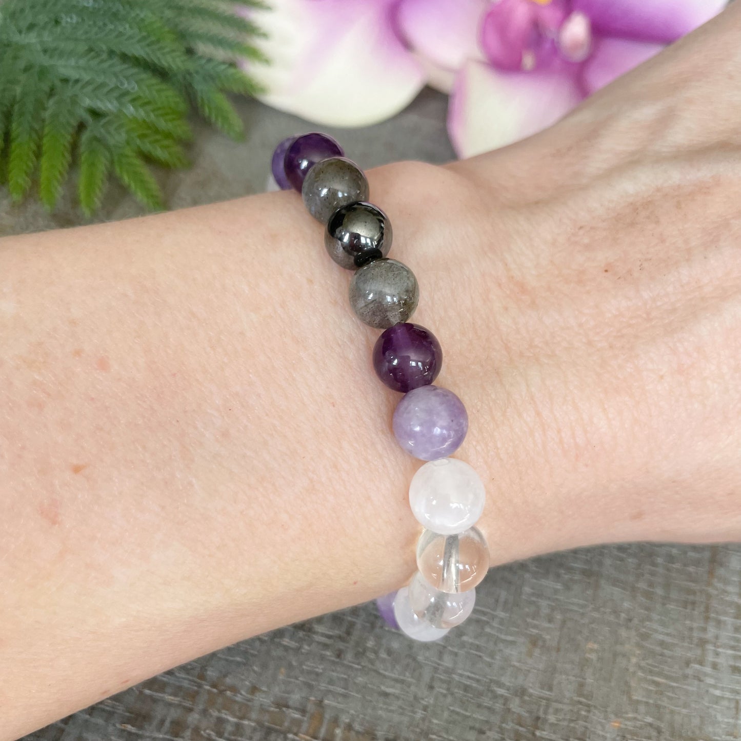 Air element bracelet on woman's wrist