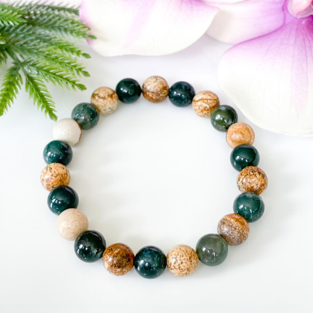 Overhead view of moss agate and jasper bracelet