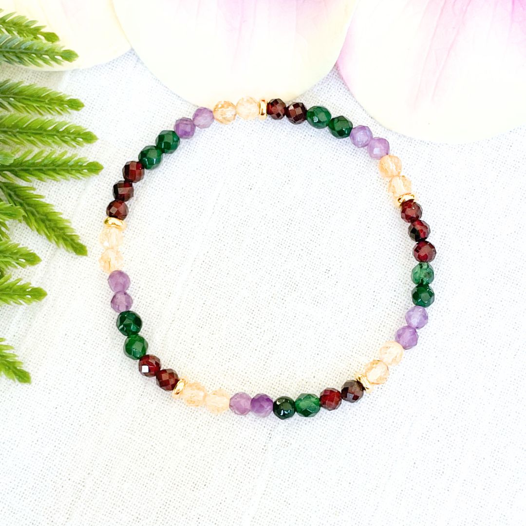 4mm money and wealth magnet bracelet made with 4mm faceted garnet, emerald, amethyst and citrine beads with small gold accents