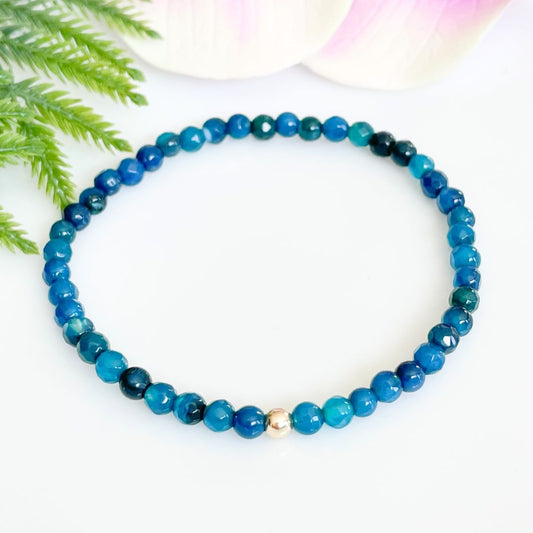 4mm faceted blue agate bracelet with gold accent bead