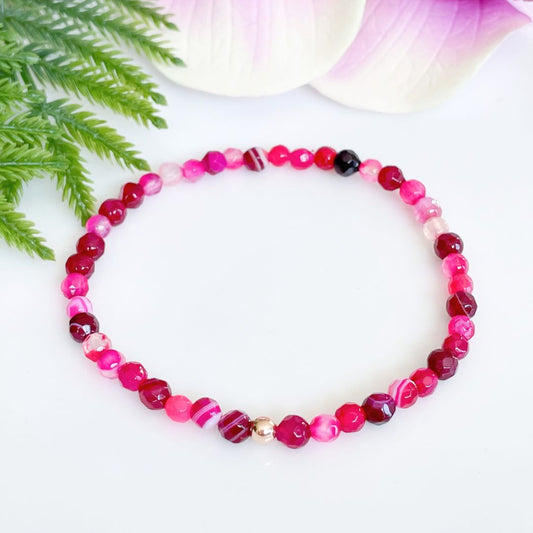 4mm faceted pink agate bracelet with gold accent bead