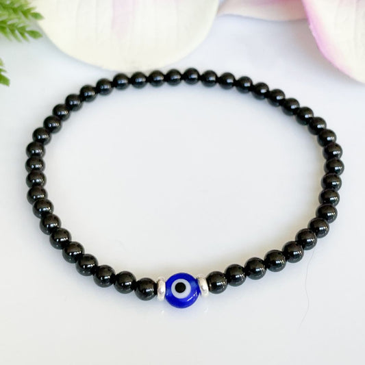 4mm Black Tourmaline Evil Eye Bracelet for Men Overhead view