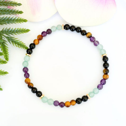 4mm wealth and prosperity bracelet made with black tourmaline, tigers eye, amethyst, and green aventurine with gold accents