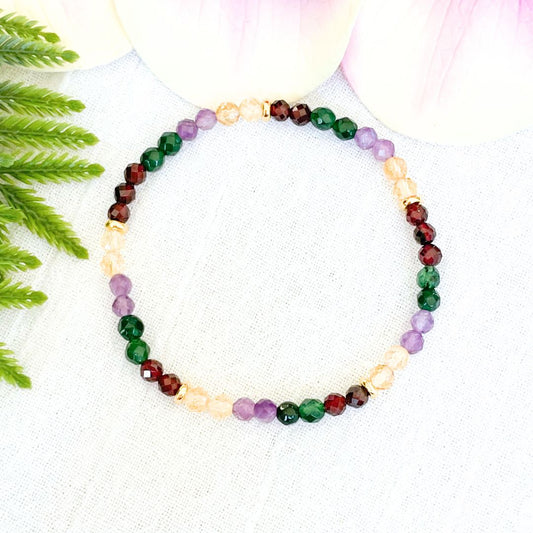 4mm money and wealth magnet bracelet made with 4mm faceted garnet, emerald, amethyst and citrine beads with small gold accents