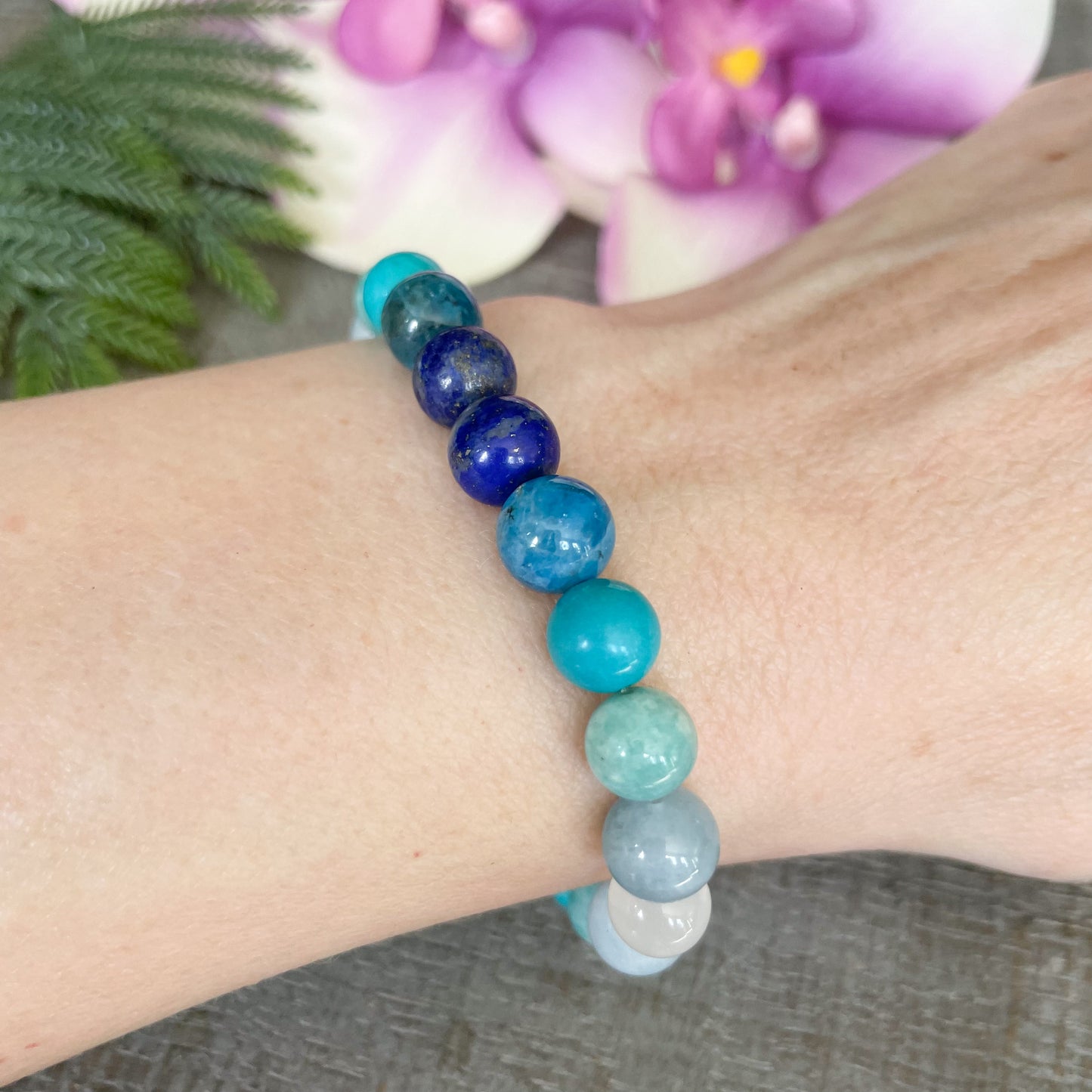 water element bracelet on woman's wrist